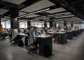 Modern corporate office with data dashboards