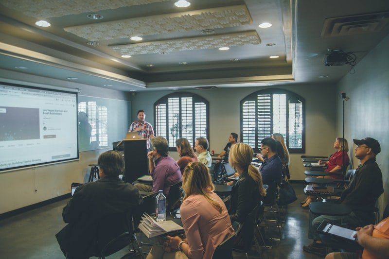 Modern classroom with AI-powered adaptive learning systems and collaborative tools