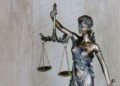 Judge gavel next to laptop representing AI legal regulation