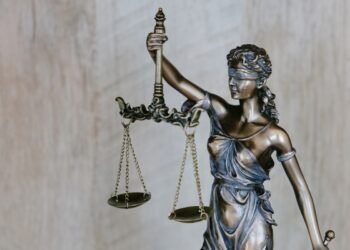 Judge gavel next to laptop representing AI legal regulation
