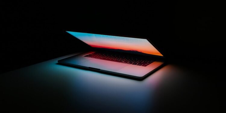 Person using AI tools on a laptop