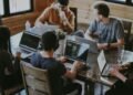 Colleagues working together at a table in a modern office