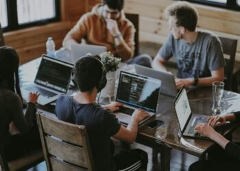 Colleagues working together at a table in a modern office