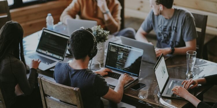 Colleagues working together at a table in a modern office