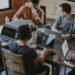 Colleagues working together at a table in a modern office