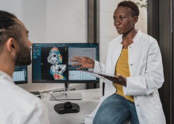 Healthcare professional using a computer in a clinical setting