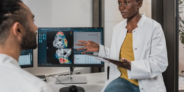 Healthcare professional using a computer in a clinical setting