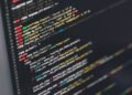 Developer working at startup Emergent on computer coding