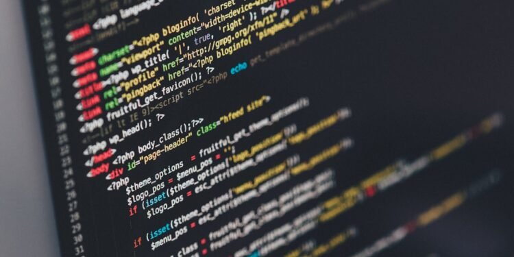Developer working at startup Emergent on computer coding