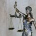 Scales of justice and gavel on a desk