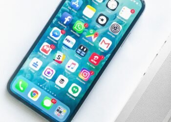 Person using smartphone with social media apps representing digital wellbeing concerns