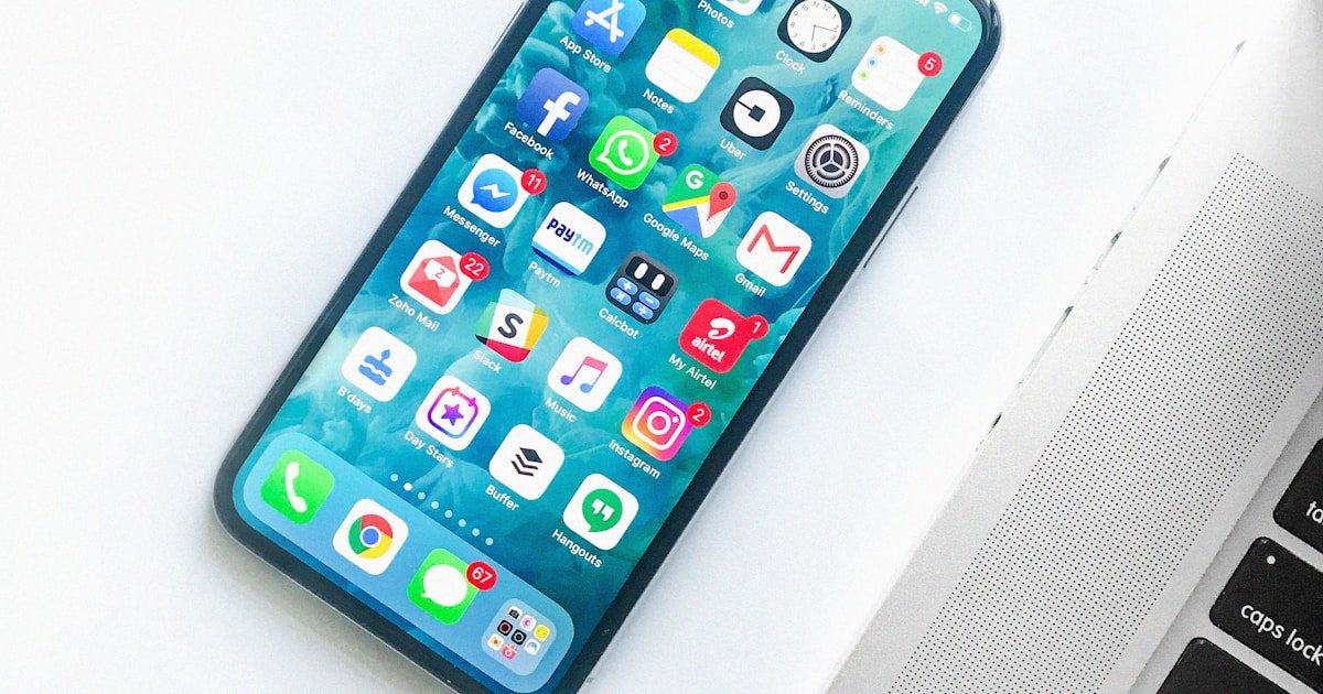 Person meditating with smartphone nearby representing digital wellness and mindfulness