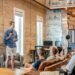 Team celebrating around a laptop in a startup office
