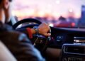 Waze navigation app showing Gemini voice search on smartphone dashboard