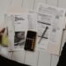 Financial documents, charts and a calculator on a desk
