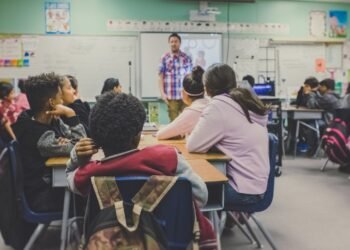 Empty high school classroom with desks and chairs