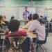 Empty high school classroom with desks and chairs