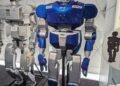 Humanoid service robot standing in a public technology exhibition space