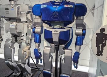 Humanoid service robot standing in a public technology exhibition space