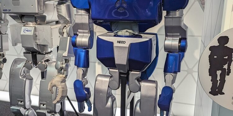 Humanoid service robot standing in a public technology exhibition space