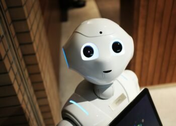 White humanoid service robot with large eyes