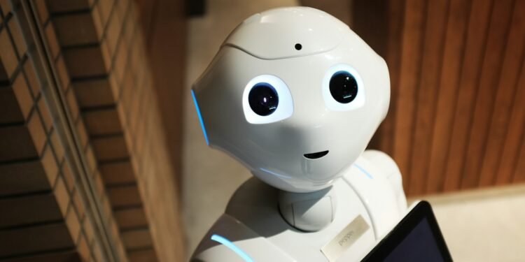 White humanoid service robot with large eyes