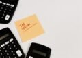 Calculators and a sticky note reading Tax Season