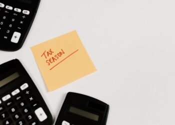 Calculators and a sticky note reading Tax Season