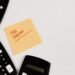 Calculators and a sticky note reading Tax Season