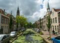 Canal in Delft lined with historic townhouses