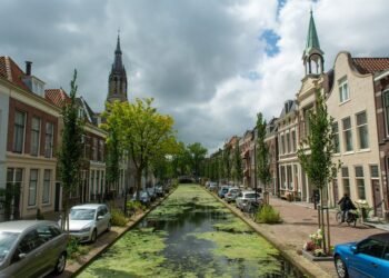 Canal in Delft lined with historic townhouses