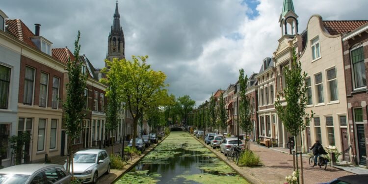 Canal in Delft lined with historic townhouses