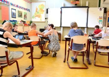 Children and a teacher in a classroom