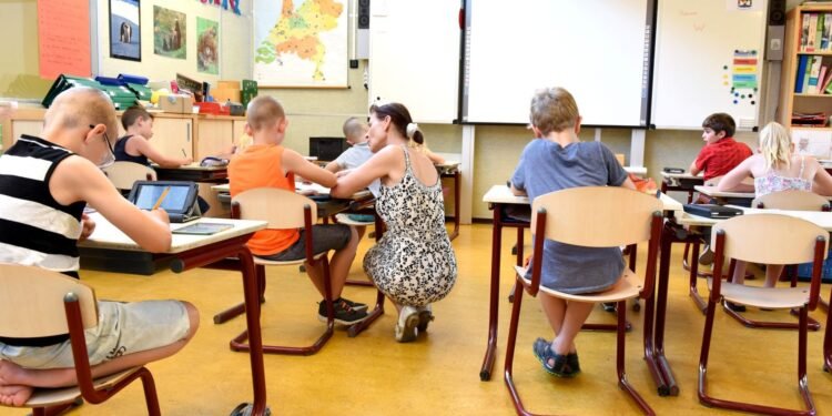 Children and a teacher in a classroom