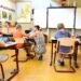 Children and a teacher in a classroom