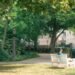 People relaxing on a bench in a park in The Hague