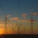 High-voltage power lines against the sky
