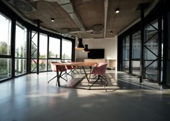 Modern open-plan office with empty meeting table