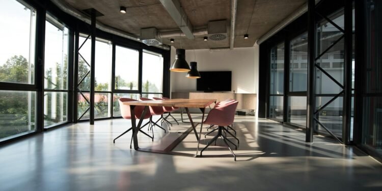 Modern open-plan office with empty meeting table